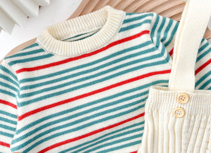 Close-up of crew neck and shoulder buttons on striped sweater