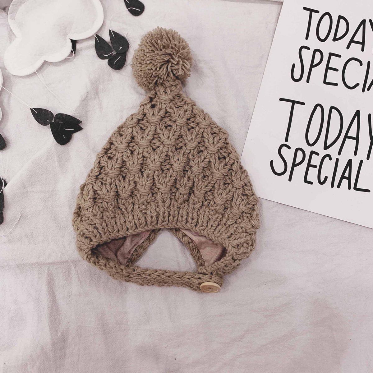 Taupe chunky knit baby bonnet with pom-pom