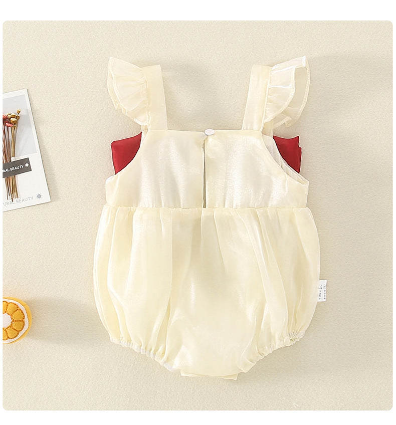 Back view of cream tulle romper with buttons