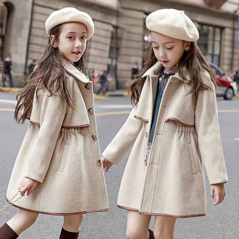 Two girls wearing matching oatmeal wool coats