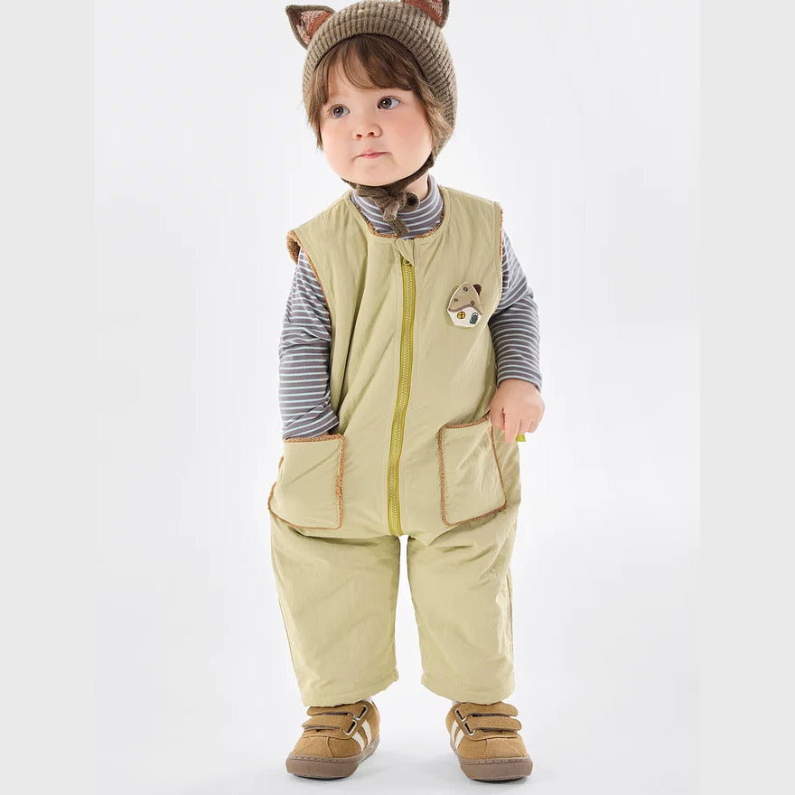 Baby in the sage zip romper, front view