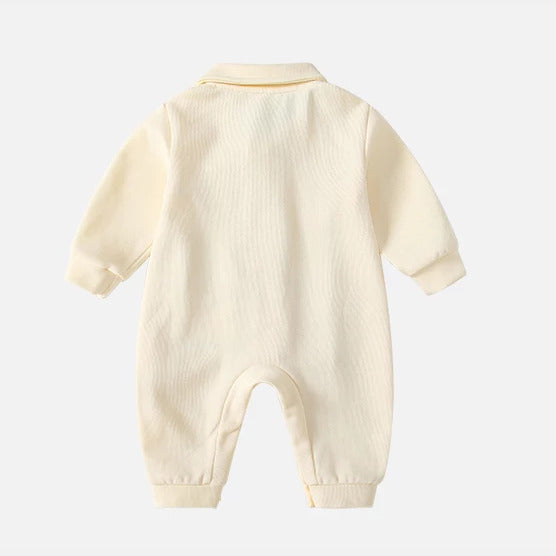 Cream collared baby romper back view, flat lay on white