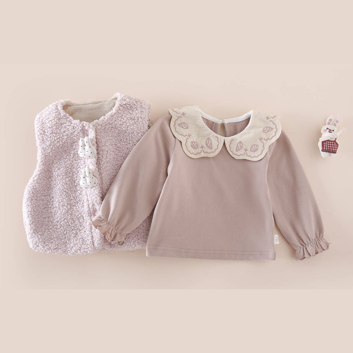 Blush pink sherpa vest and embroidered collar top set, flat lay