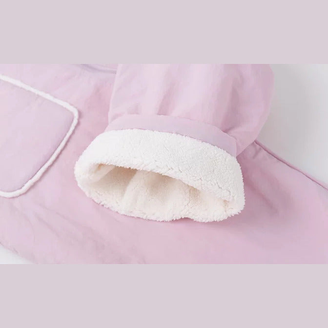 Cream sherpa lining at the cuff of the lilac pink romper