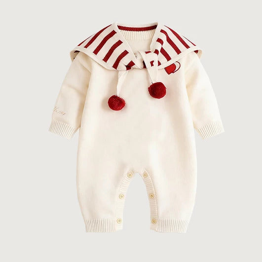 Ivory knit baby romper with red striped cape and pompom ties