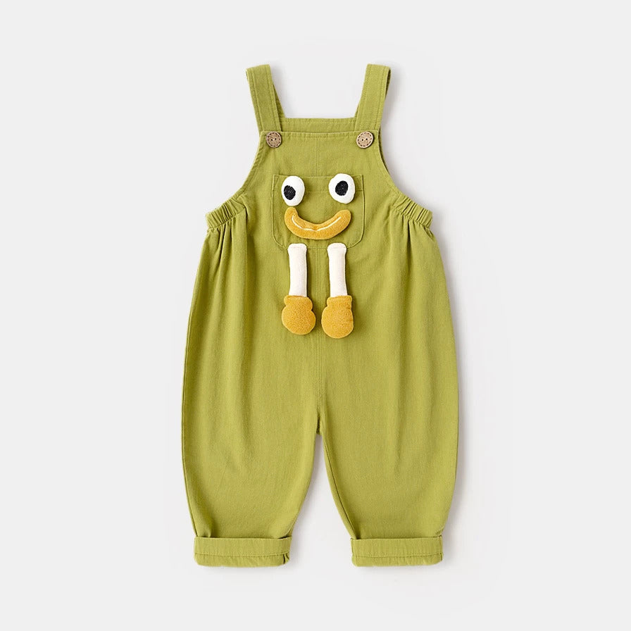 Lime green cotton kids overalls with 3D smiley face pocket, flat lay