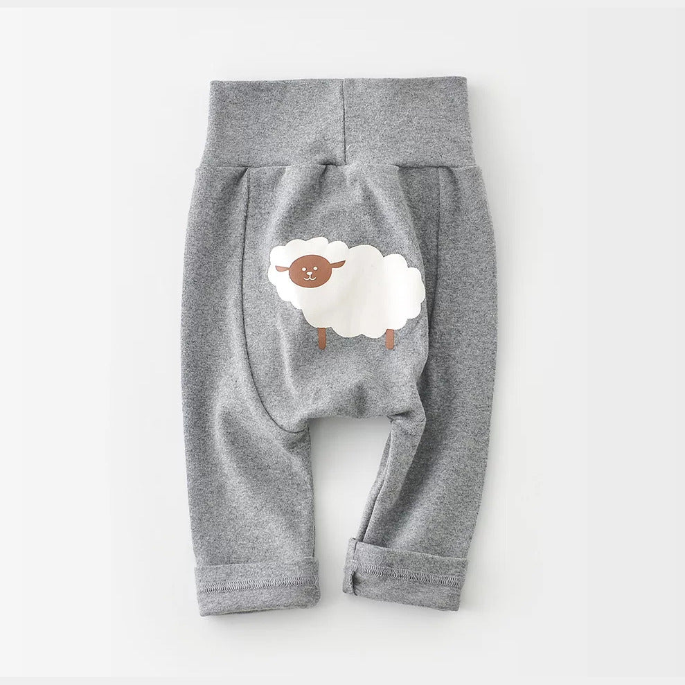 Grey high-waist baby pants with a sheep print on the bottom, flat lay