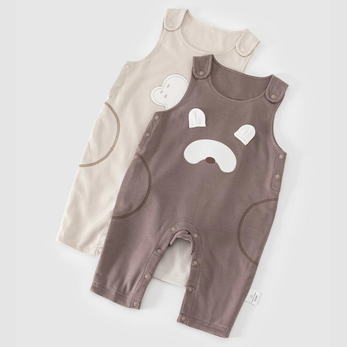 Mocha bear and almond cloud cotton baby overalls, flat lay