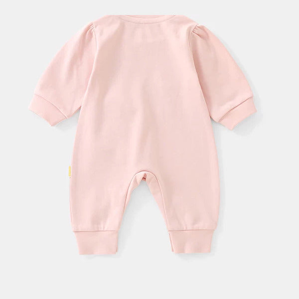 Back view of the blush pink baby romper with puff shoulders