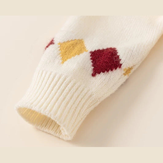 Argyle knit cuff detail in red and mustard