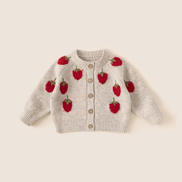 Oatmeal knit cardigan with red strawberry motifs, flat lay