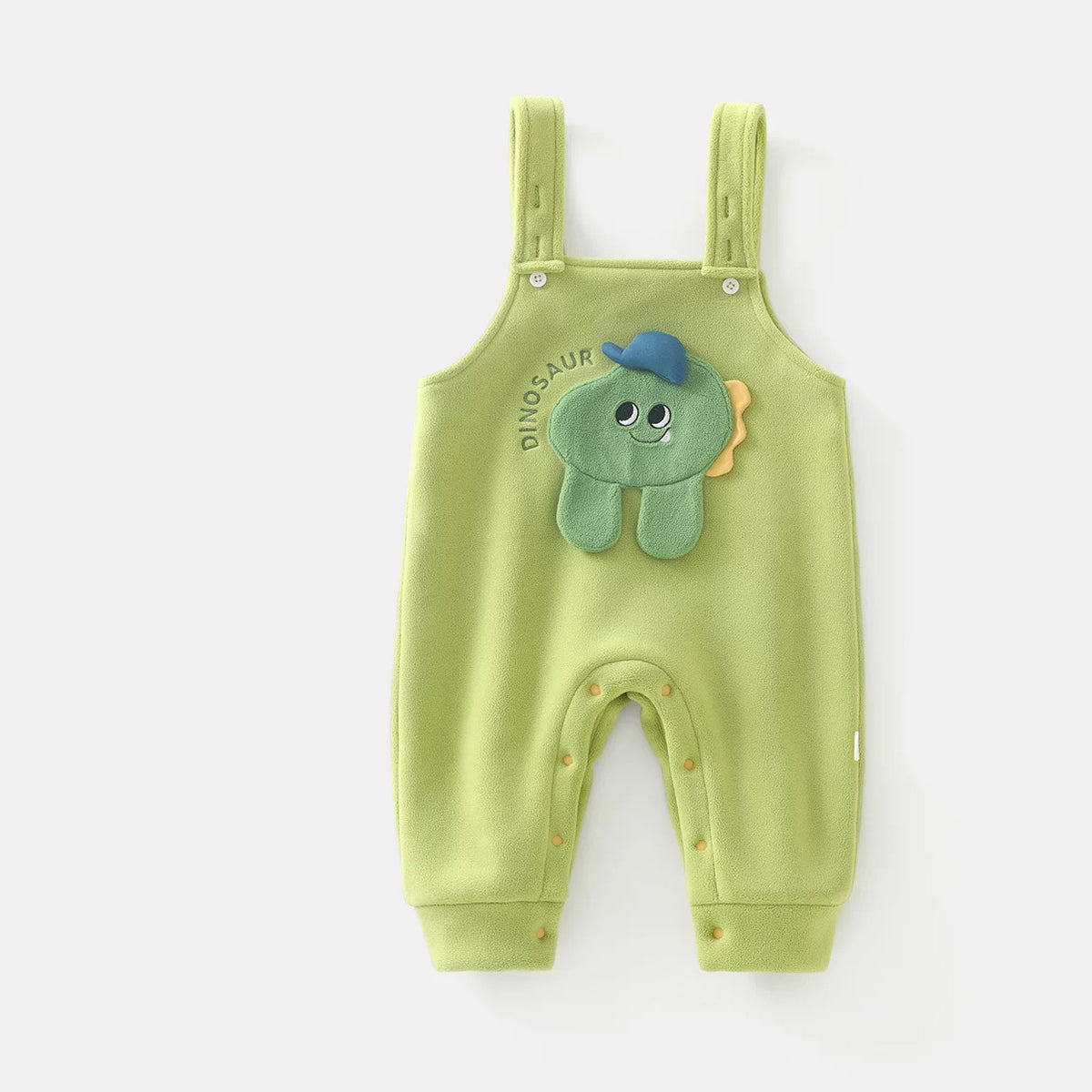 Green fleece baby overall romper with plush dinosaur patch, flat lay