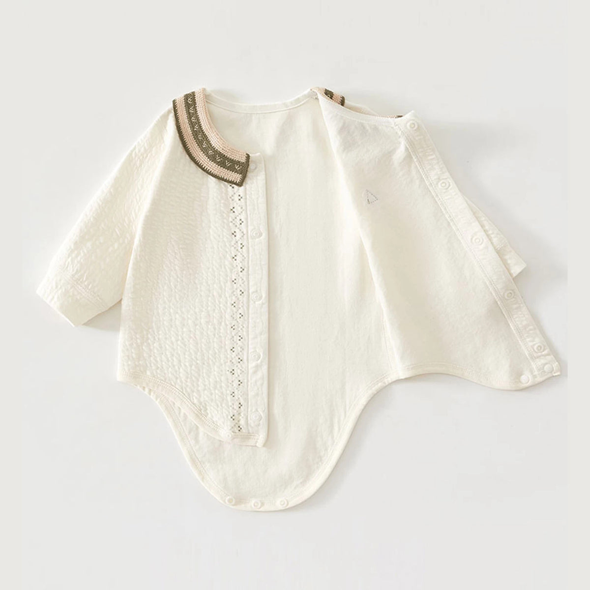 Cream textured bodysuit shown open along its full snap front