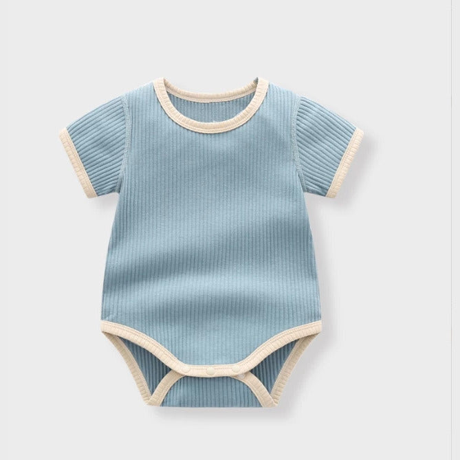 Sky blue ribbed baby bodysuit with cream contrast trim, flat lay