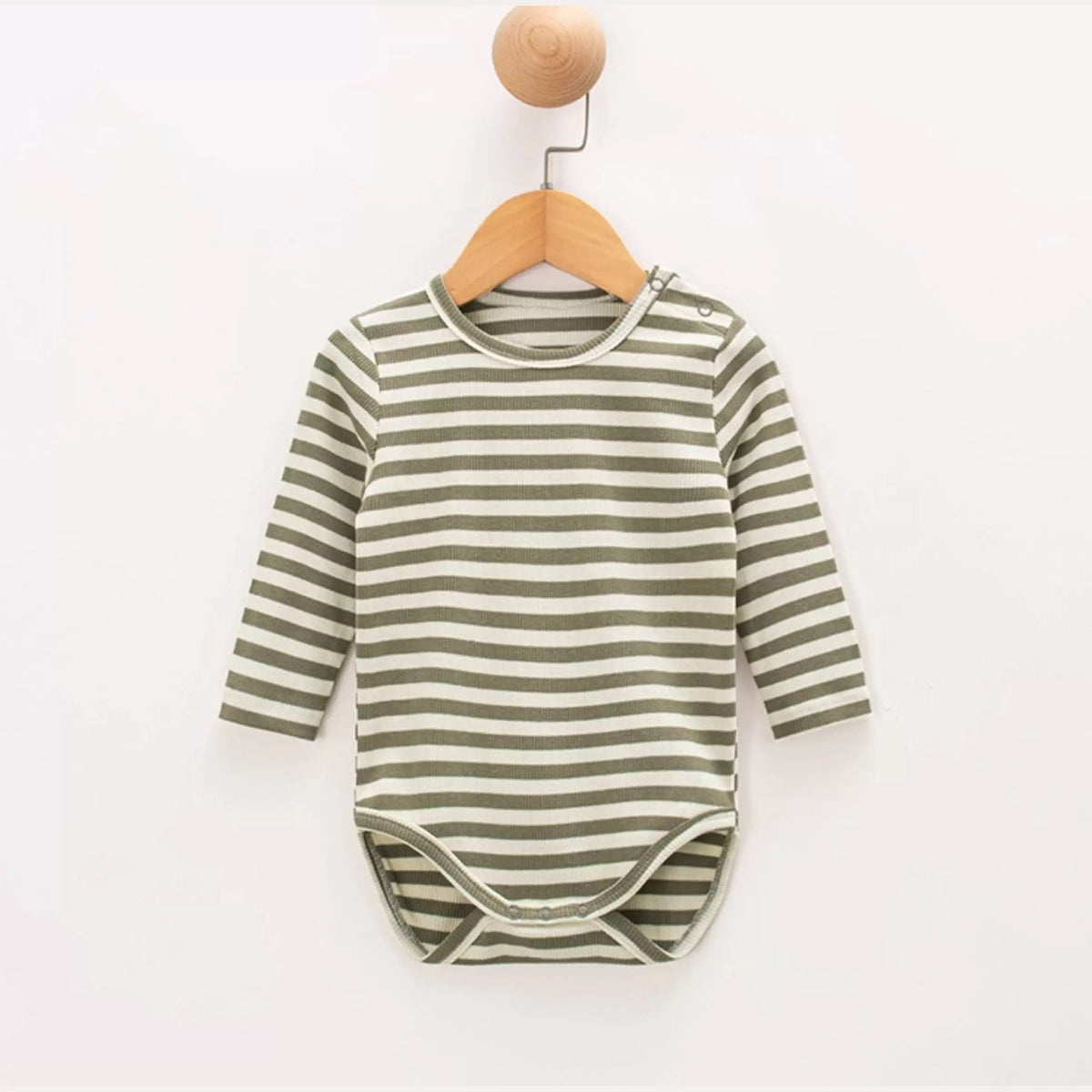 Sage stripe long-sleeve baby bodysuit on a wooden hanger