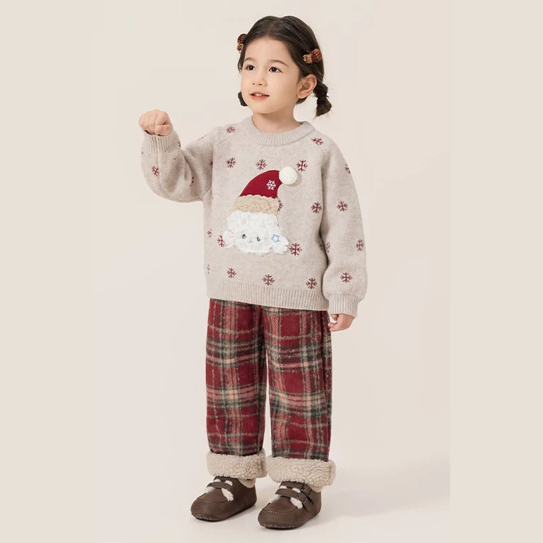 Little girl in the puppy knit sweater and red plaid pants