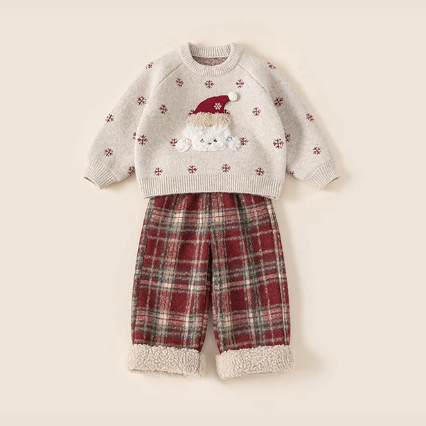 Girls outfit: puppy knit sweater over red tartan pants, flat lay