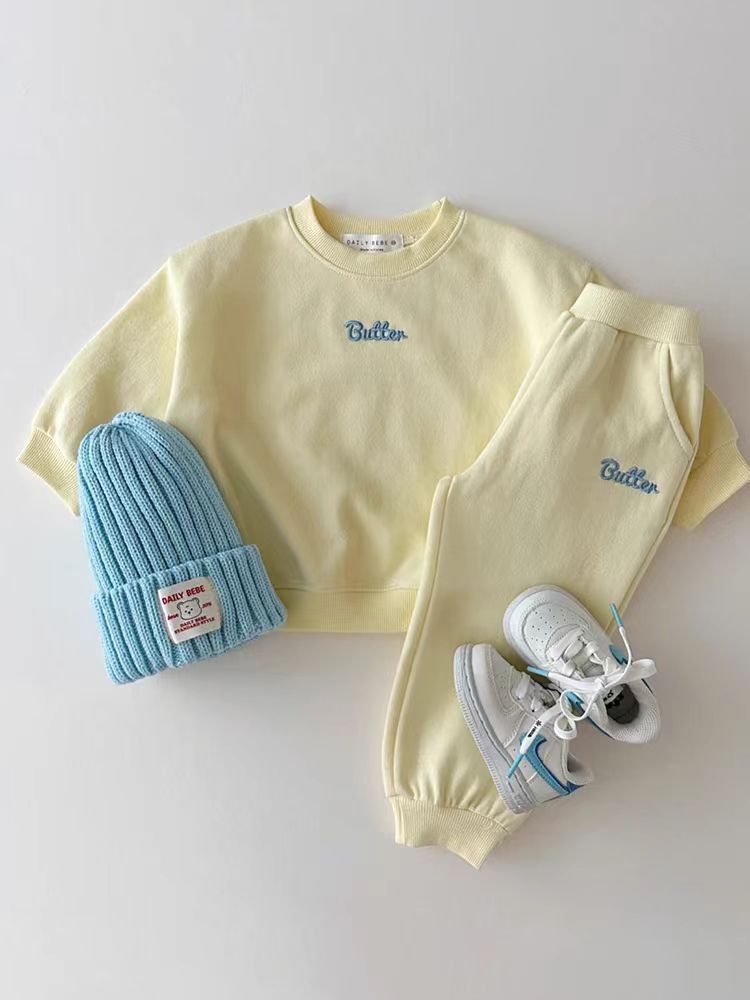Yellow sweatshirt and joggers styled with beanie and shoes