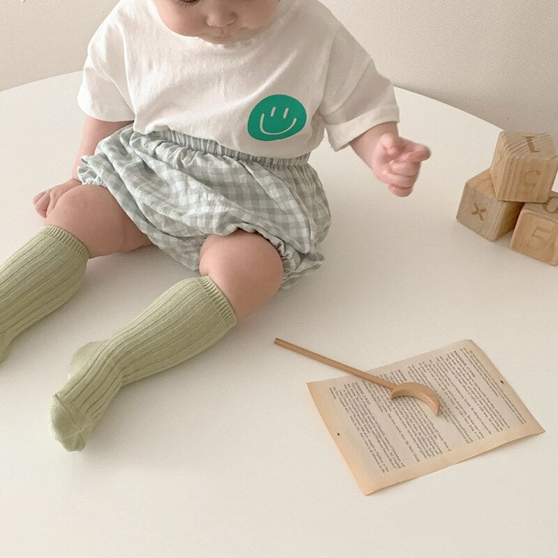 Smiley Face T-shirt and Plaid Shorts
