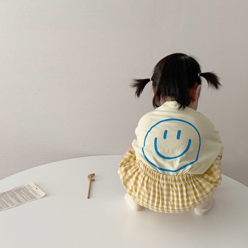 Smiley Face T-shirt and Plaid Shorts