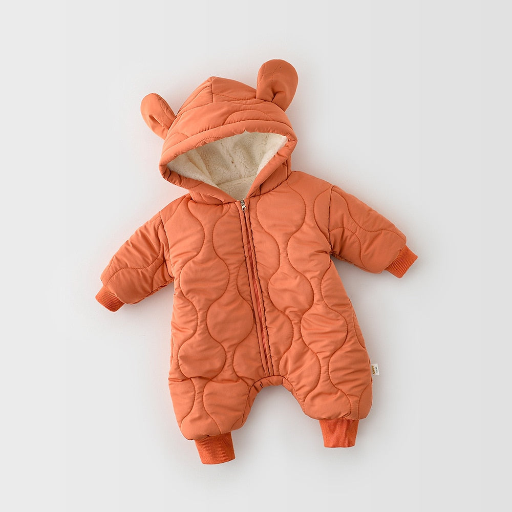Full view of an orange quilted baby jumpsuit featuring a cozy fleece-lined hood with cute bear ears. Designed for warmth and comfort, it has a soft inner lining and ribbed cuffs on the wrists and ankles to provide a snug fit, perfect for keeping little ones warm during colder weather.