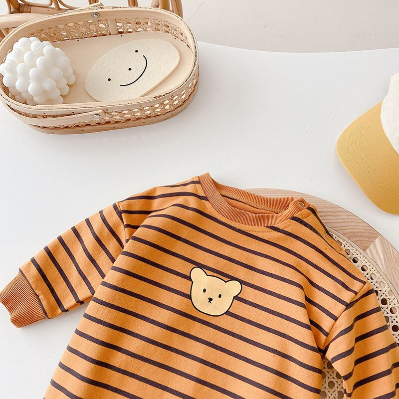 Orange striped baby jumpsuit with bear face appliqué