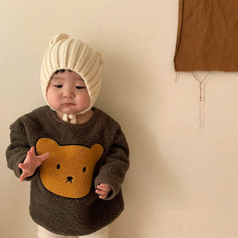 Baby wearing brown teddy bear sherpa sweatshirt