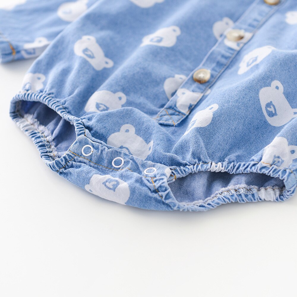 Close-up of snaps on denim bodysuit