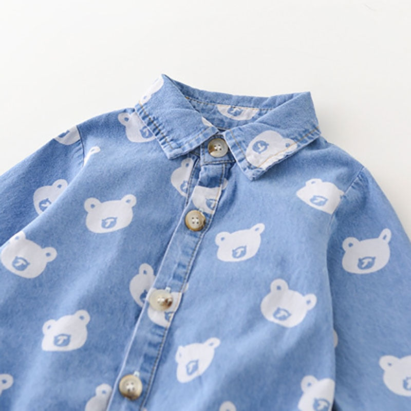 Close-up of collar and bear print denim