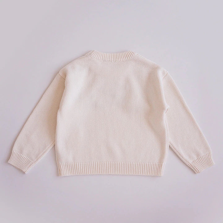 Back view of beige knit pullover