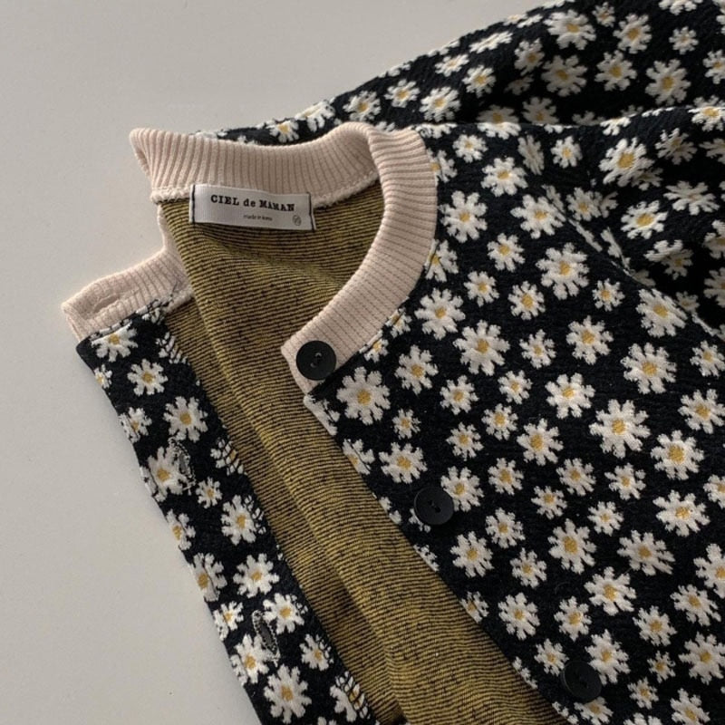 Black daisy cardigan opened showing inside