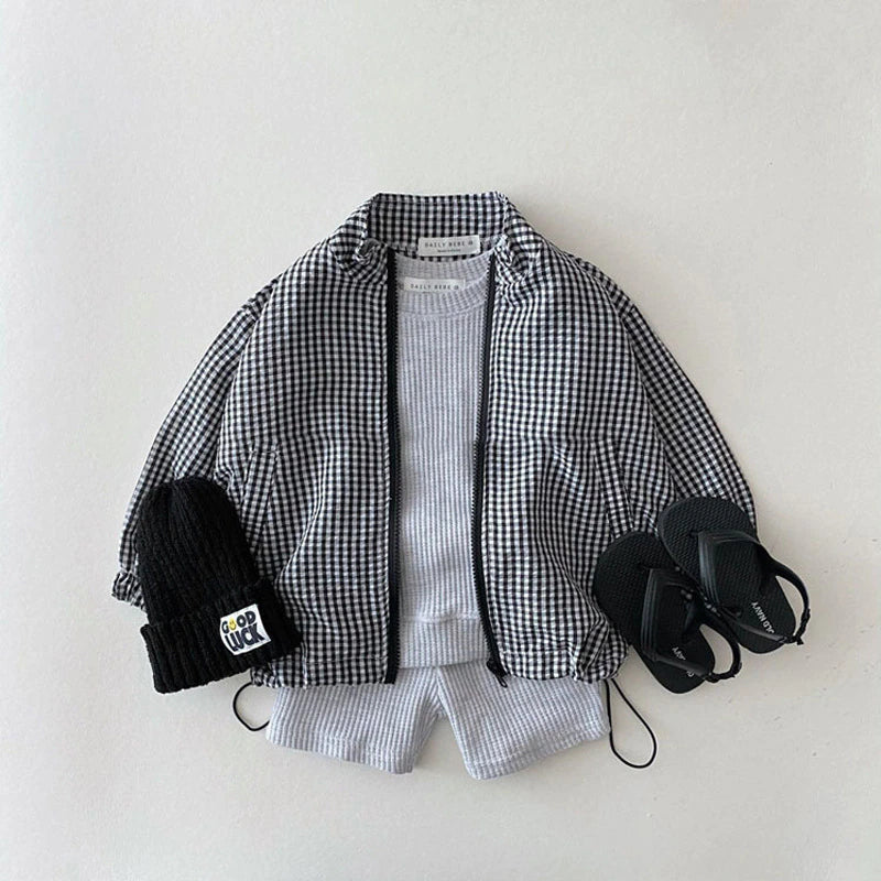 Black gingham sun jacket styled with beanie and shoes