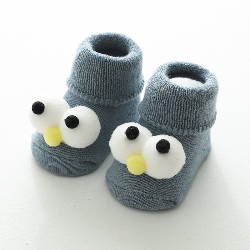 Blue thick baby socks with big googly eyes
