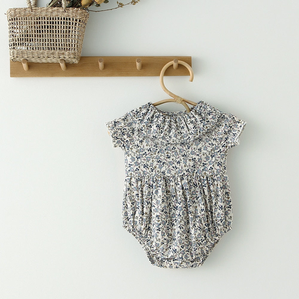 Blue floral short sleeve ruffle collar romper