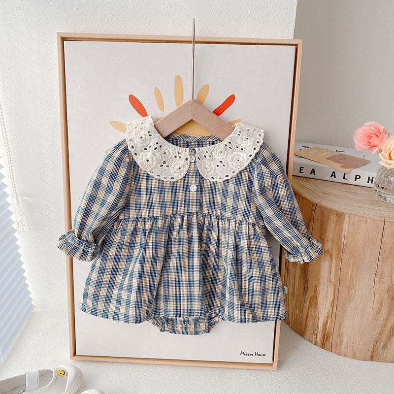 Blue plaid dress bodysuit with lace collar in a frame