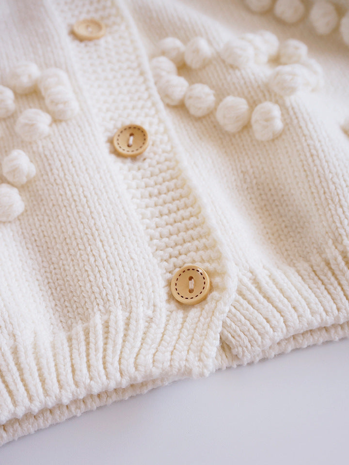 Close-up of wooden buttons and hem