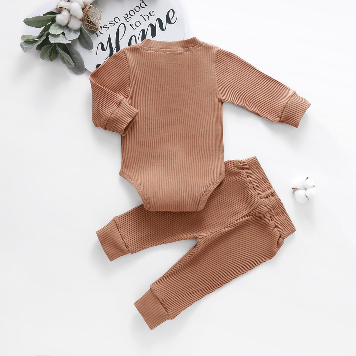 Brown ribbed bodysuit and pants on white background