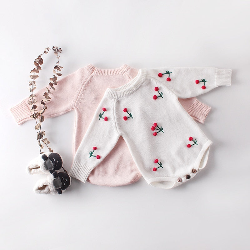 Pink and white cherry knit bodysuits with accessories