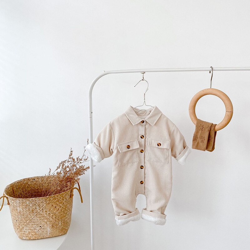 Beige corduroy jumpsuit on a clothes rail