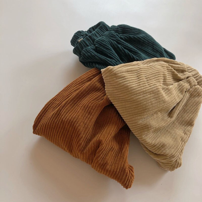 Folded pile of corduroy pants