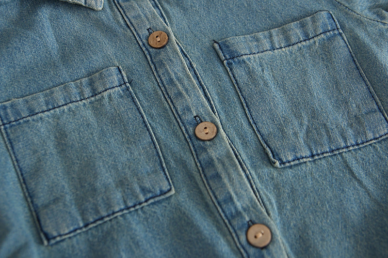Close-up of pockets and buttons on denim romper