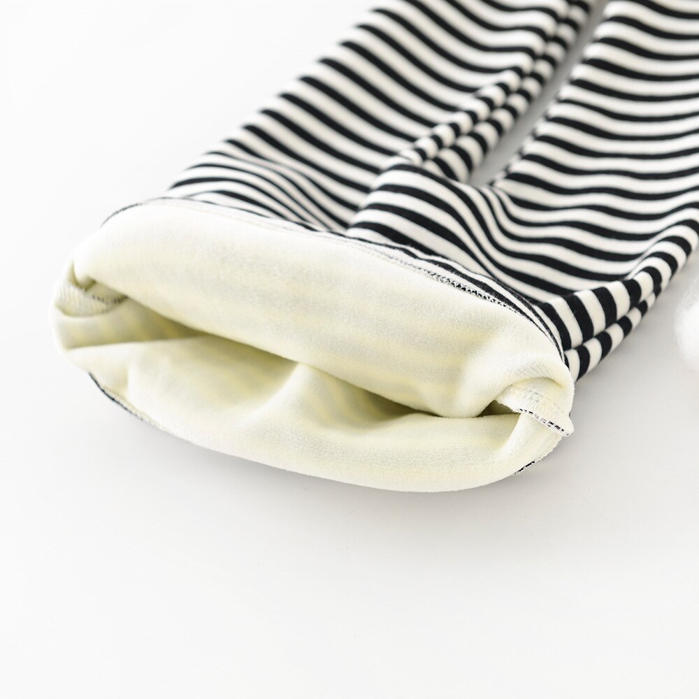 Close-up of fleece lining in striped leggings