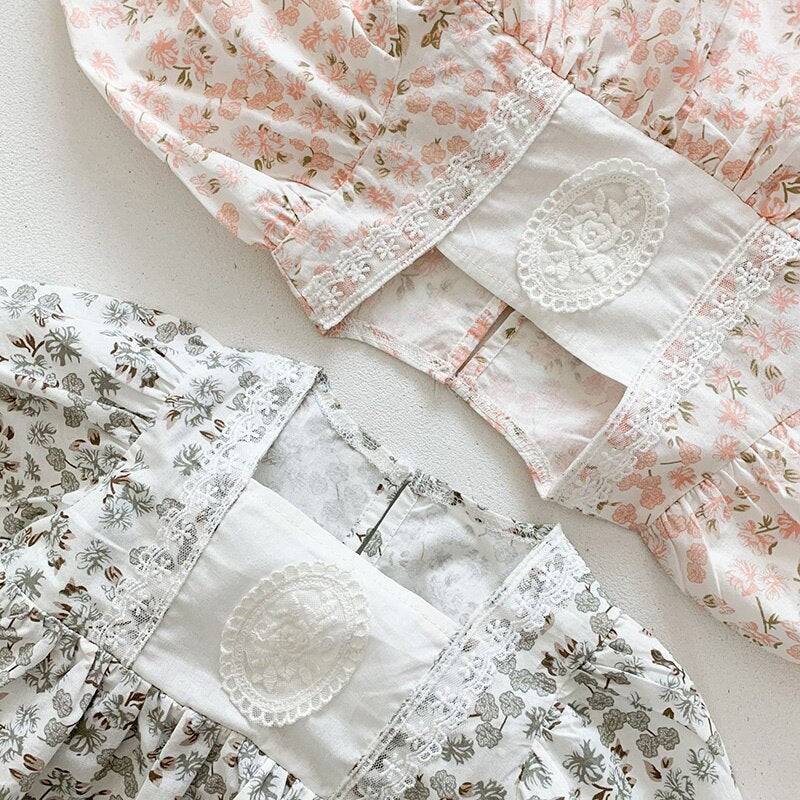 Close-up of lace bib on floral dresses