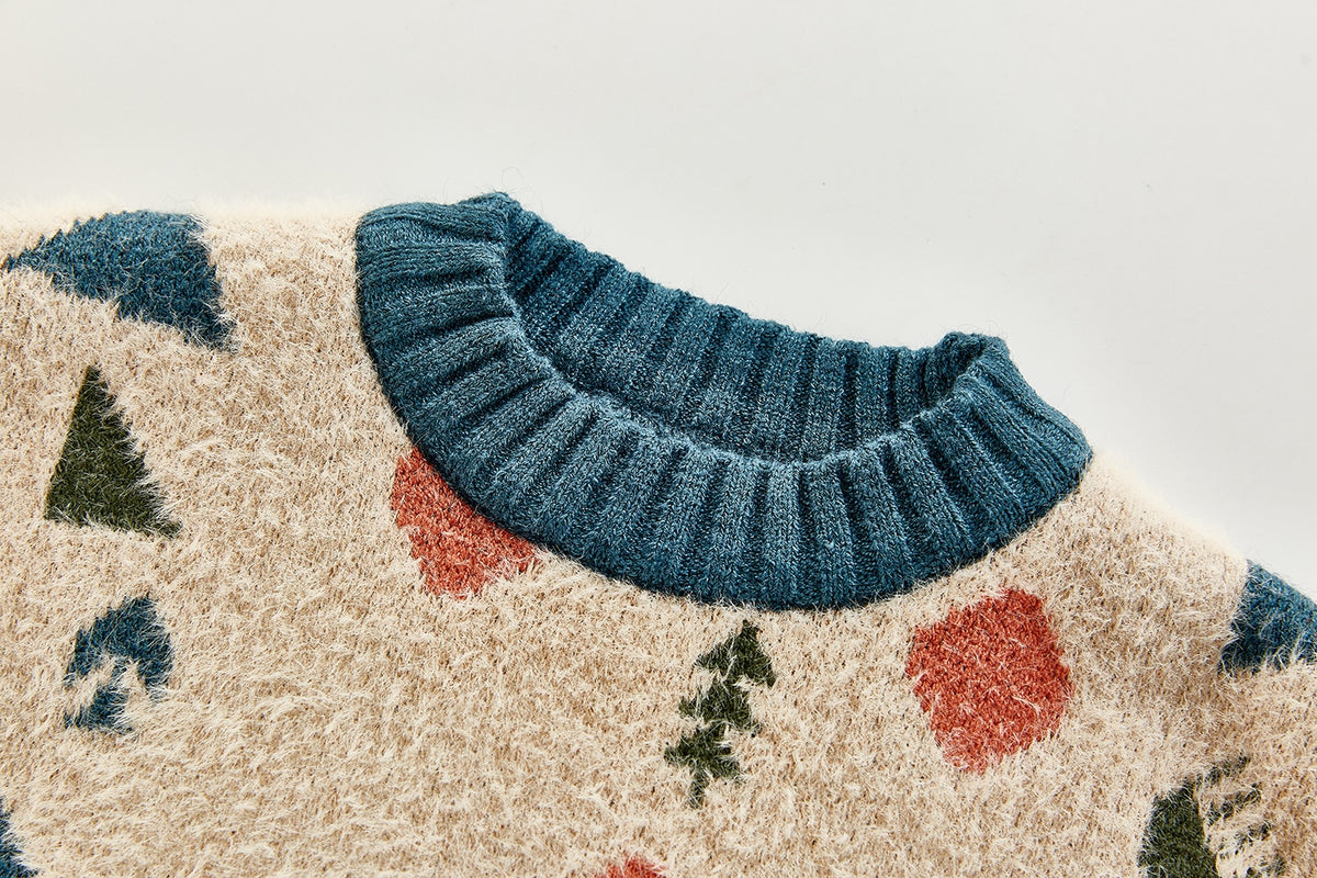 Close-up of neckline on apricot geometric sweater