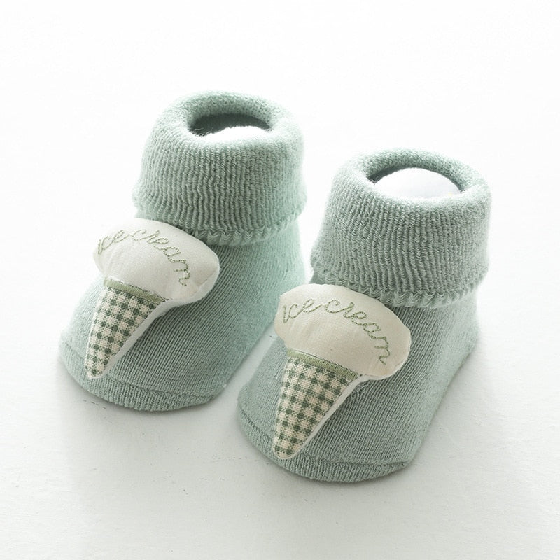 Green thick baby socks with ice cream toppers