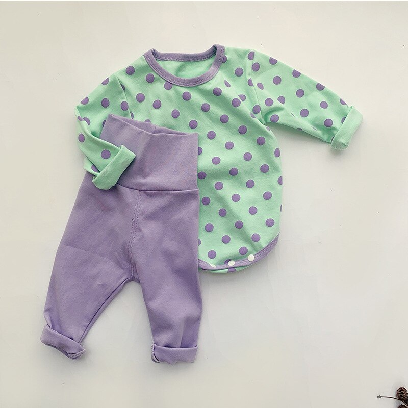 Green polka dot bodysuit with purple leggings