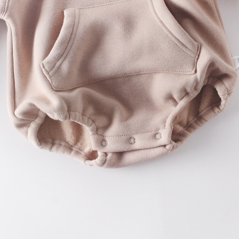Close-up of snaps on hoodie bodysuit