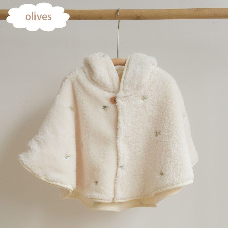 Olives embroidered cape on a hanger