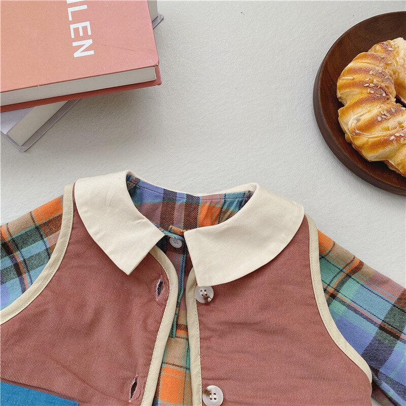 Close-up of Peter Pan collar and fleece vest