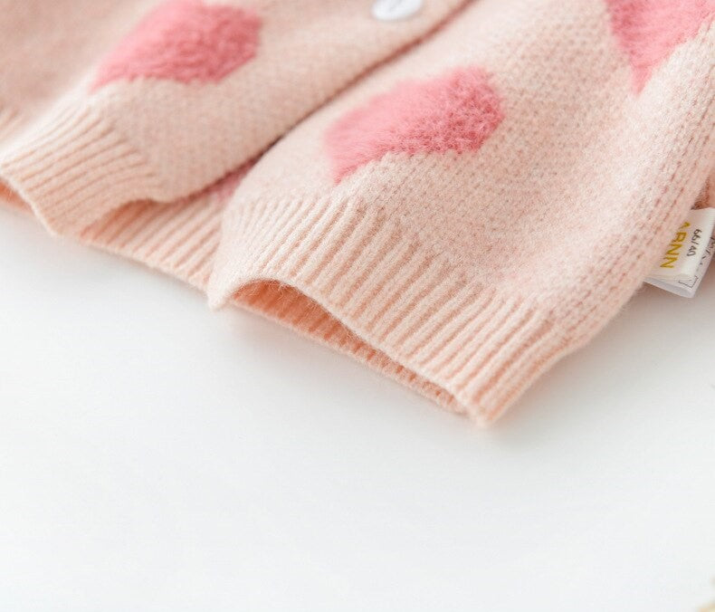 Close-up of fluffy pink heart knit